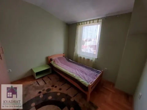 Bedroom with a single bed, window, and hardwood flooring. - image 20