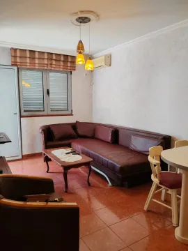 Living room with a sofa set and a dining table. - image 11