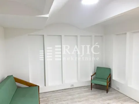 Empty bright room with a green armchair and sofa. - image 3