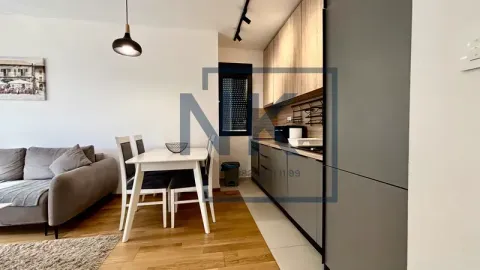Living room with dining area and kitchen in an open space. - image 2