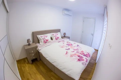 Bedroom with a double bed, nightstands and air conditioning. - image 10
