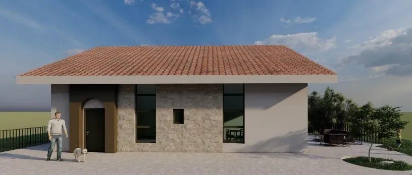Prikaz eksterijera kuće sa popločanim dvorištem i fasadom od kamena.