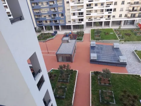 View from the terrace overlooking the landscaped courtyard and surrounding buildings. - image 11