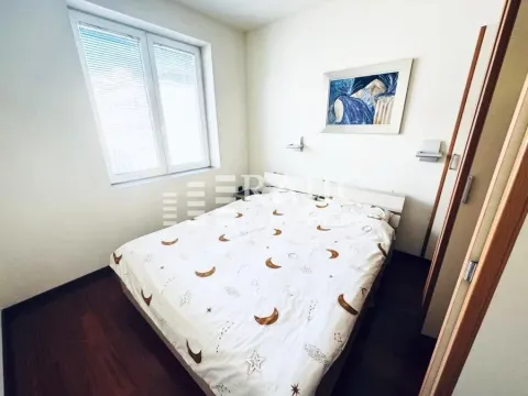 Small bedroom with a double bed, window and a painting on the wall. - image 13