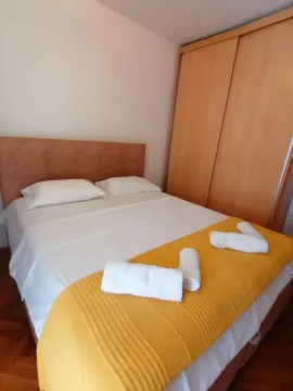 Bedroom with a double bed and a built-in wardrobe. - image 6