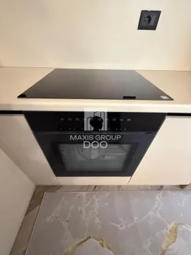 Built-in oven and ceramic hob on the kitchen countertop. - image 9