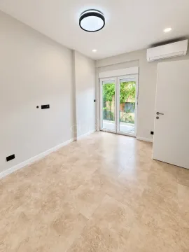 Empty room with tiled floor and air conditioning unit. - image 4