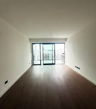 Empty living room with wooden flooring and access to the terrace. - image 2