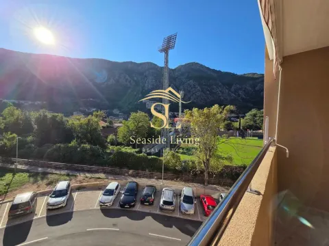 View from the terrace overlooking surrounding greenery, hills, and parking. - image 15