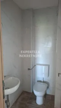 Small bathroom with a sink and toilet. - image 6
