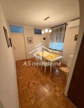 Dining area with a table, chairs, and parquet flooring. - image 8