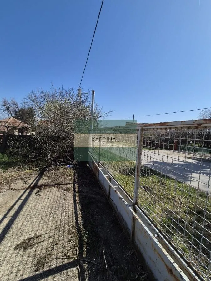 Fenced yard and property entrance.
