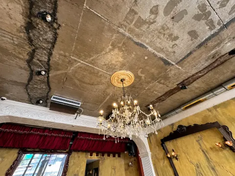 View of the ceiling with a chandelier and decorative interior elements. - image 8