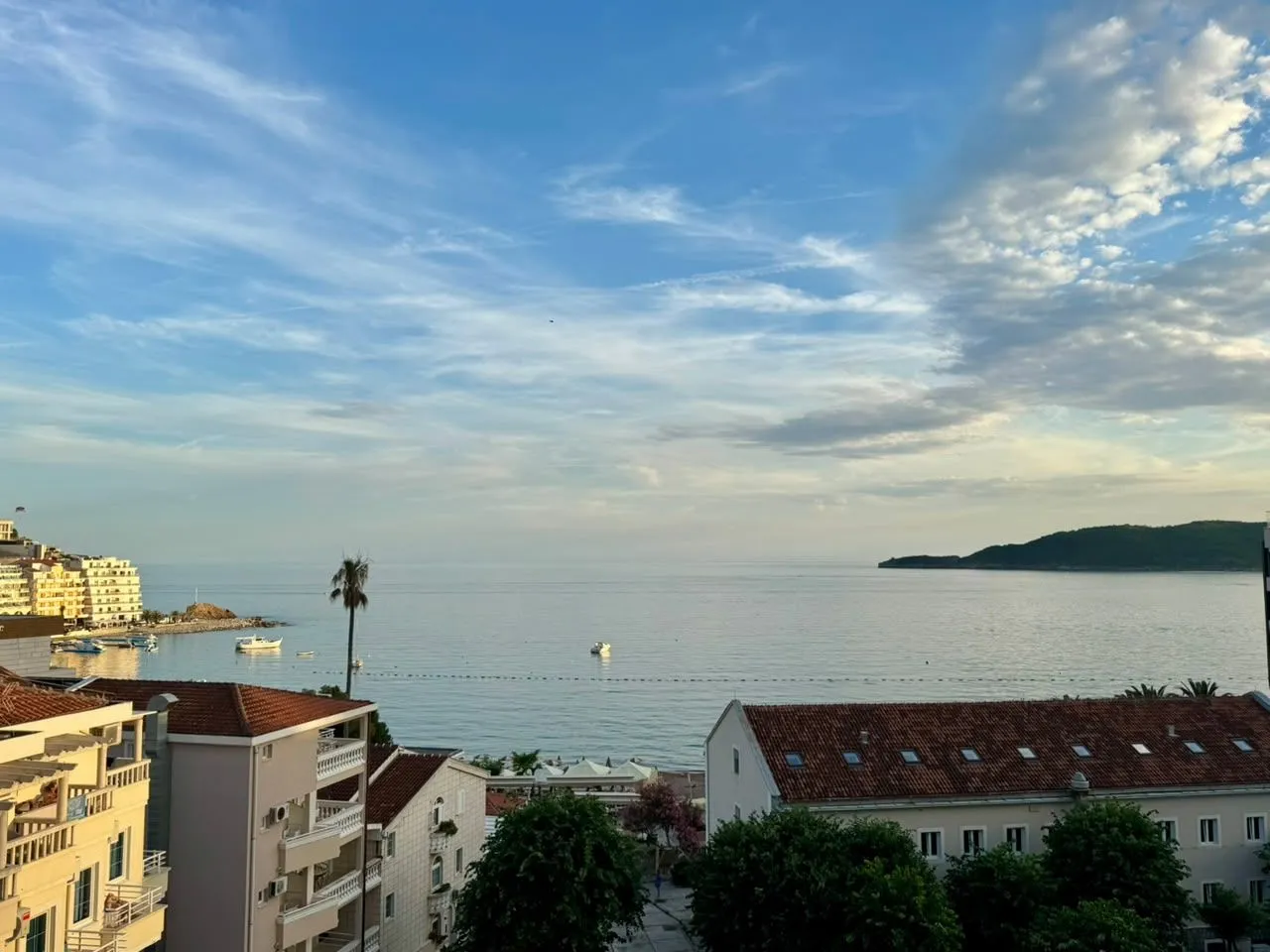 View of the sea and surrounding buildings from the property's terrace.