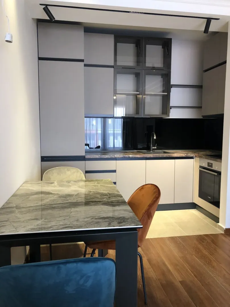 Modern kitchen with a dining table.