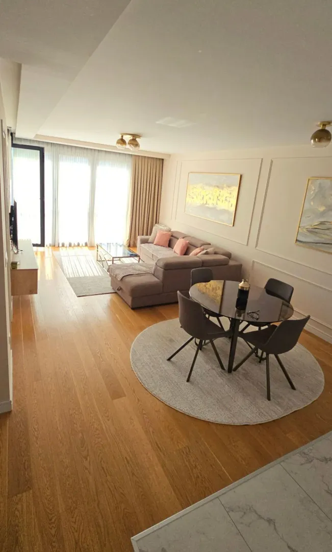 Spacious living room with a sofa set and a dining area.