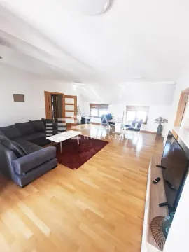 Spacious living room with a sofa set and dining area. - image 12
