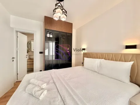 Furnished bedroom with a double bed, wardrobe, and an ensuite bathroom. - image 20