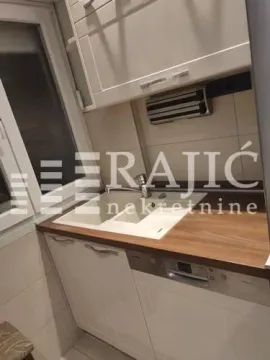 Part of the kitchen with a sink and lower cabinets. - image 6
