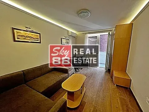 Living room with a sofa set, coffee table, and access to the terrace. - image 7