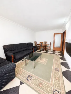 Spacious living room with seating set and dining table. - image 11