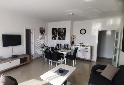 Spacious living room with a dining area and modern furniture. - image 3
