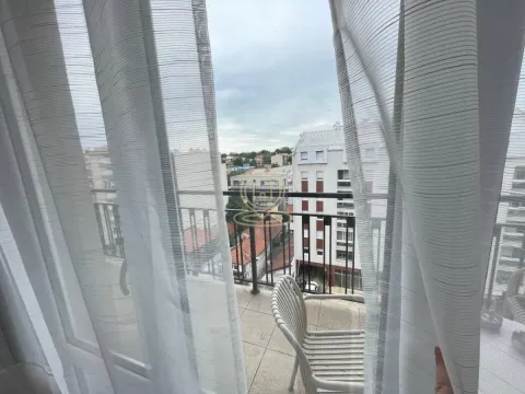 City view from the balcony through white curtains. - image 3
