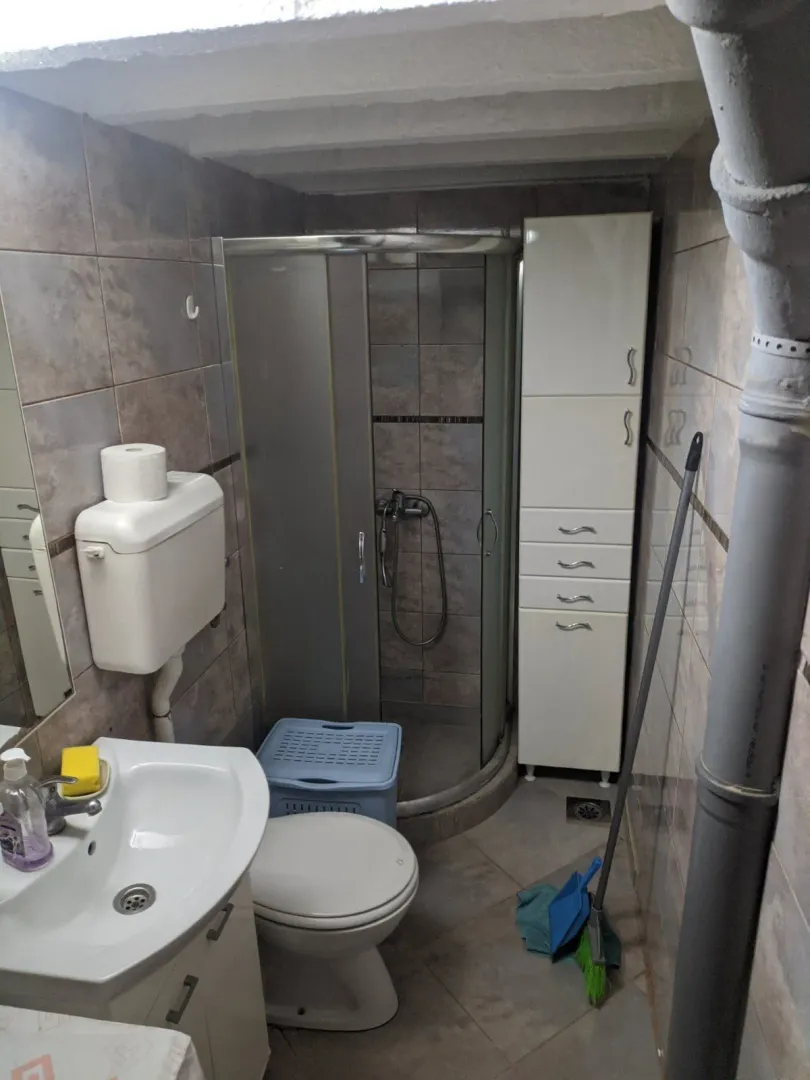 A small bathroom with a shower.