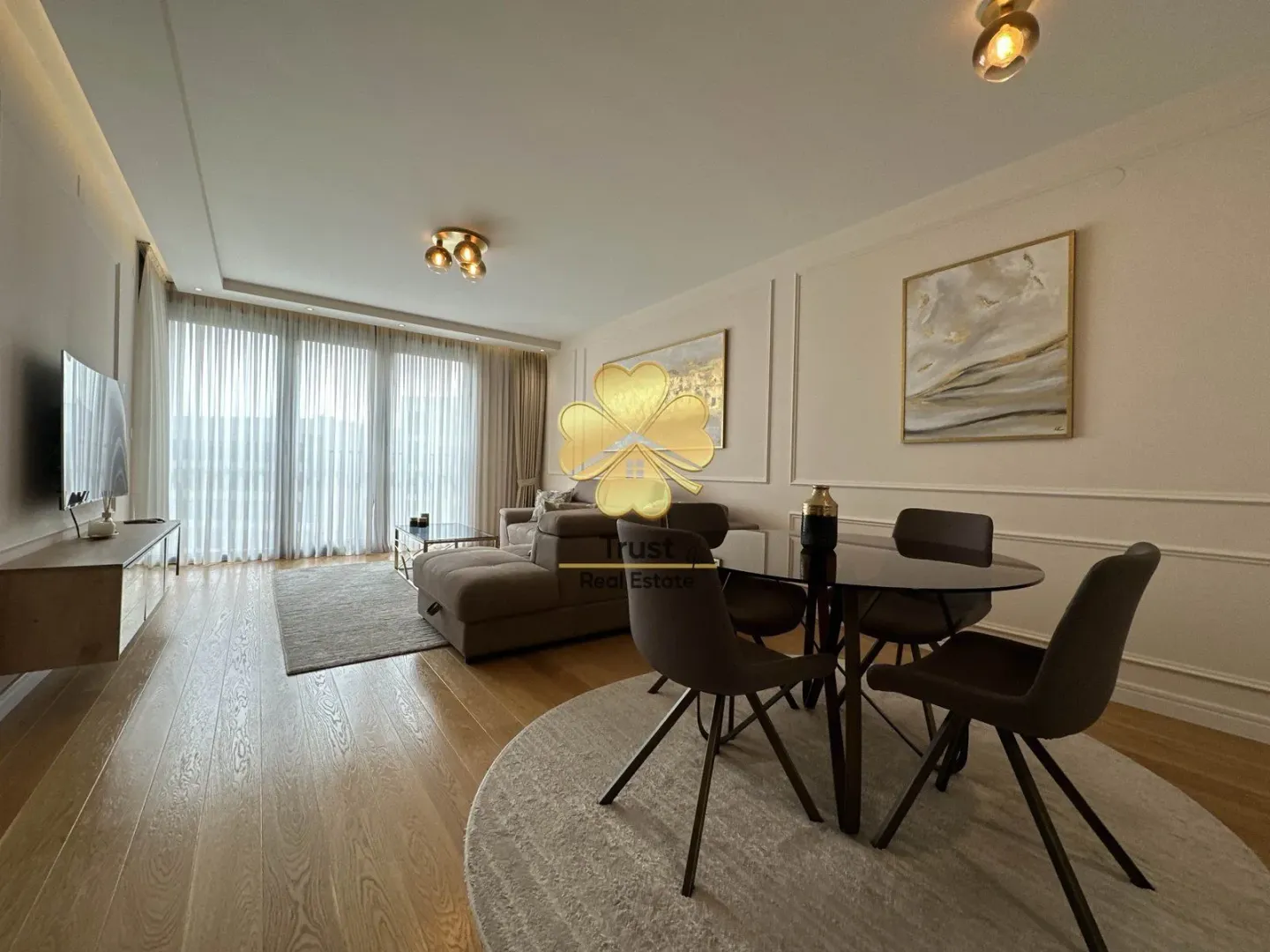 Modern and bright living room with a dining area.
