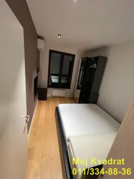 Smaller bedroom with a bed and a wardrobe. - image 13