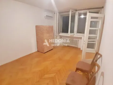 Empty room with parquet flooring, a window, and an air conditioning unit. - image 2