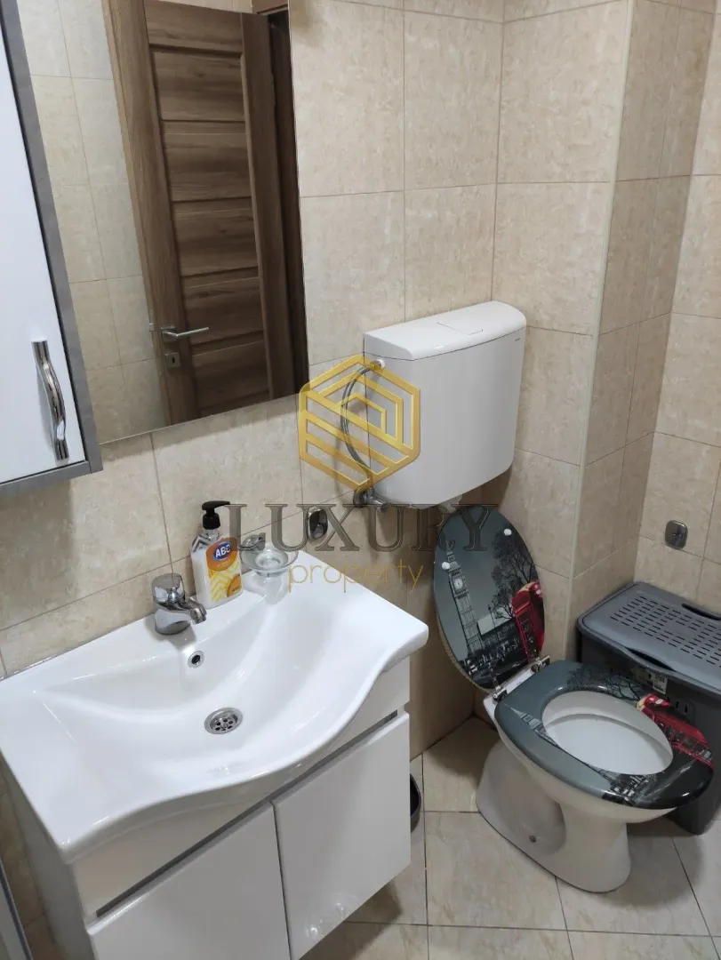 Small bathroom with a sink and toilet.