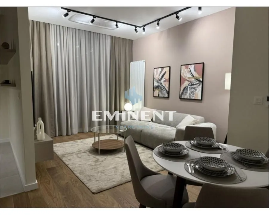 Living room with a dining area and modern furniture.