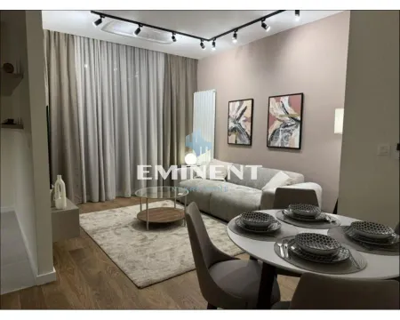Living room with a dining area and modern furniture. - image 13
