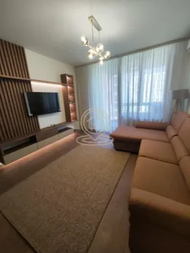 Modern living room with sofa, TV unit and wooden wall panels. - image 2