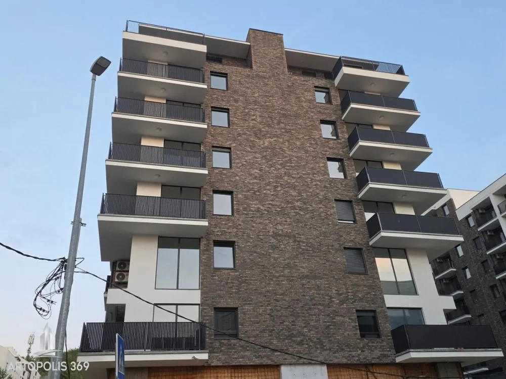 View of the exterior of a modern residential building with balconies.
