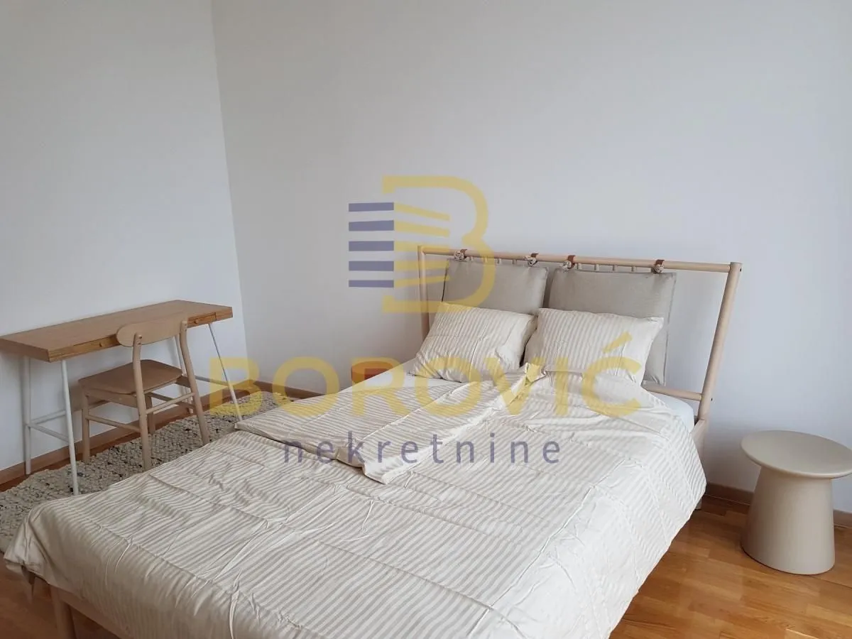 Bedroom with a double bed and a desk.