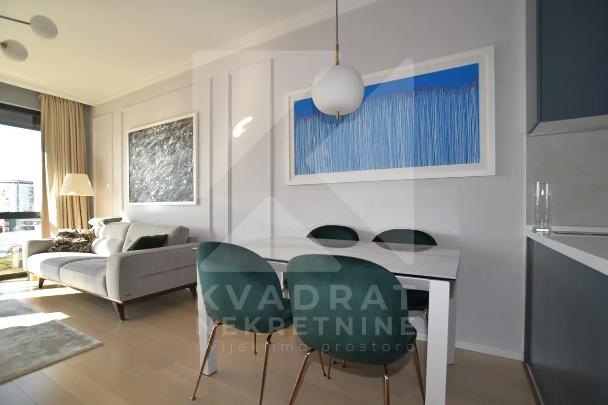 Living room with dining area and sofa.
