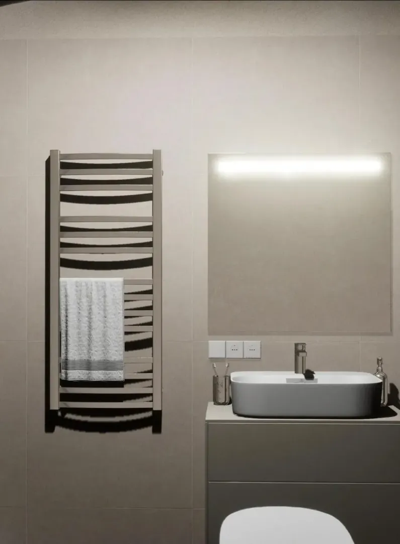 Modern bathroom with a washbasin, mirror and towel warmer.