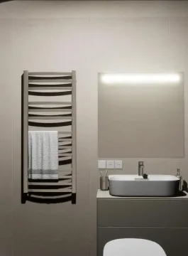 Modern bathroom with a washbasin, mirror and towel warmer. - image 24