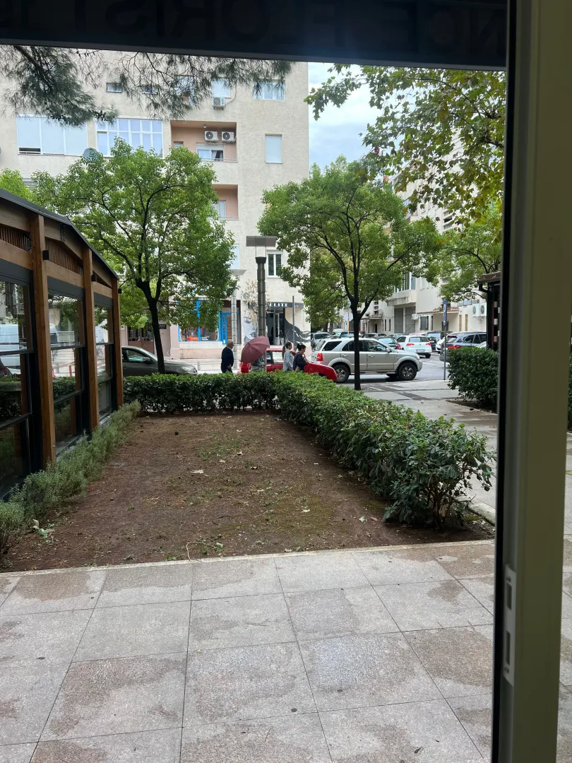 View from the property overlooking the courtyard, street, and parked cars.