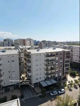 Aerial view of residential and commercial buildings in the city. - image 8