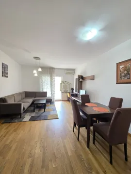 Living room with sofa and dining area. - image 11