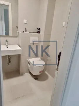 Newly equipped bathroom with a washbasin, mirror, and wall-hung toilet. - image 4