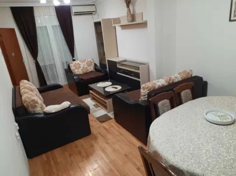 Living room with a seating set and a dining table. - image 2