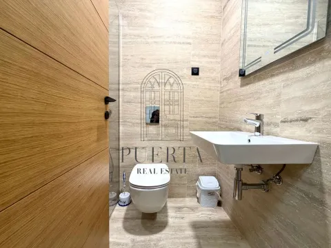Modernly equipped bathroom with a washbasin and toilet. - image 15