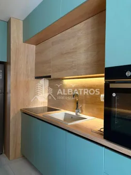 Modern kitchen with built-in appliances and lighting. - image 7