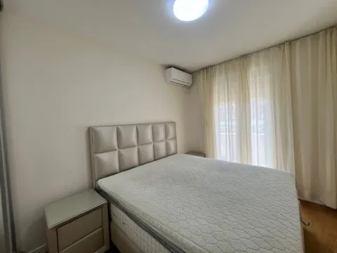 Furnished bedroom with a double bed and nightstands. - image 15