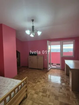 Furnished bedroom with pink walls and access to the terrace. - image 11