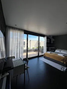 Modern bedroom with a double bed and access to the terrace. - image 3
